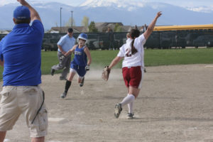Tegan Elliot comes into third base with coach Borden waving her on past Hamilton third baseman Liz Taylor. Jean Schurman photo.