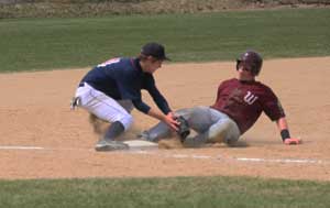 Logan Leuck tags out a Deer Lodge runner during the first game of the double header on Sunday. Jean Schurman photo.