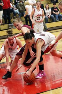 and Julie Abrahamsen scramble for the ball with an unidentified Alberton player as Lacey Dolcater (20) watches. Jean Schurman photo