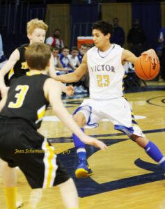 A couple of Westby-Grenora players try to caontain Victor's Kyle Ball during Victor's opening game of the state tournament. Ball finished with 16 points. Jean Schurman photo